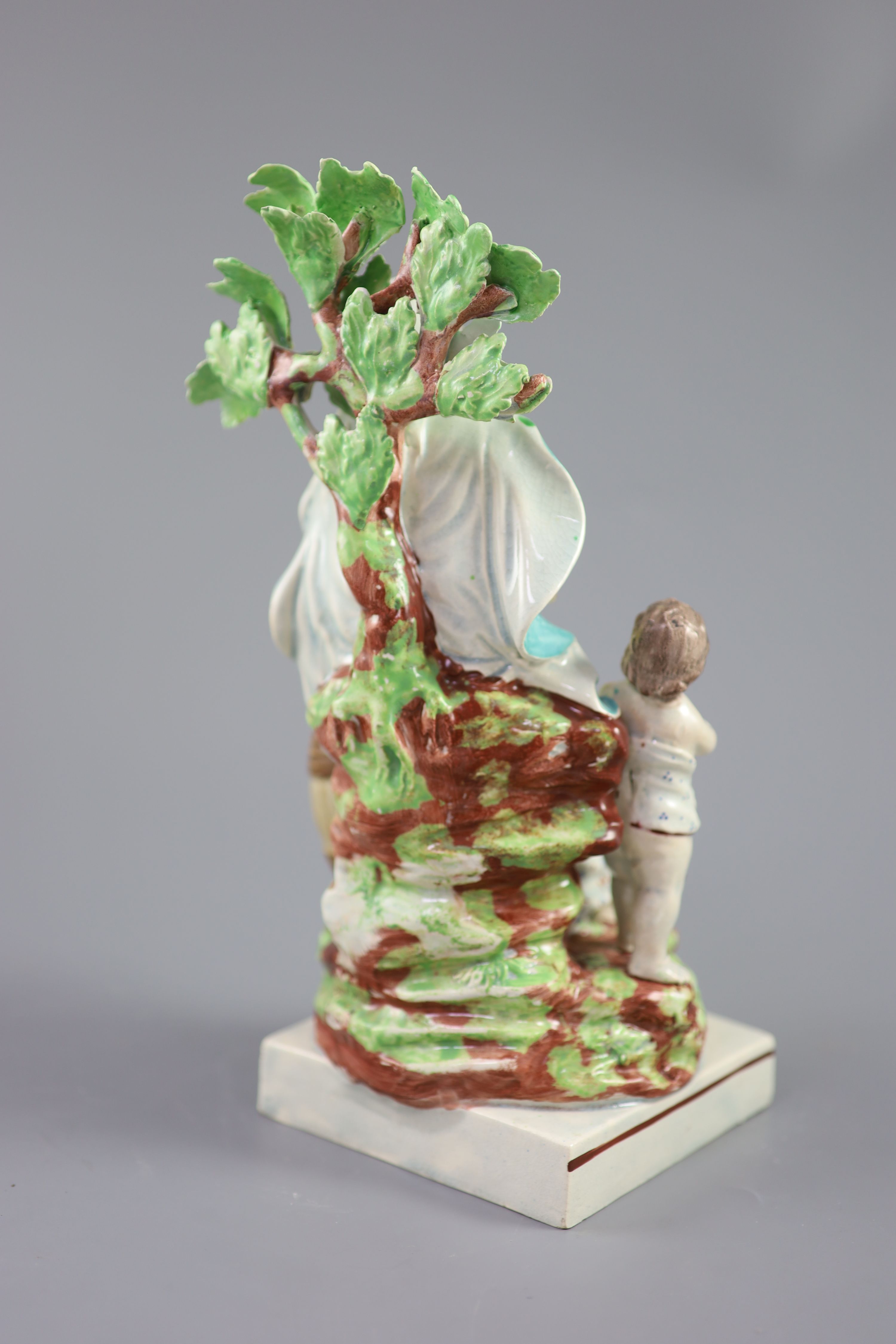 A Ralph Wood type group of a widow of Zarepeth with oil and barrel, c.1790-1810, 27.5cm high